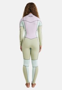 Full-body wetsuit in pale green and pastel blue, featuring long sleeves, a high collar, and contrasting stitching details.
