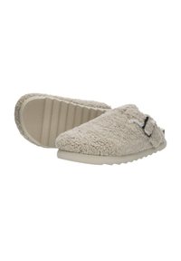 Beige, gestructureerde slippers met een zachte, harige bovenkant en rubberen zool, met een strikaccent en een lichtgewicht, casual ontwerp.