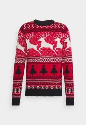 Maglione di Natale rosso con renne bianche, alberi di Natale neri e motivi geometrici in nero, bianco e rosso scuro.