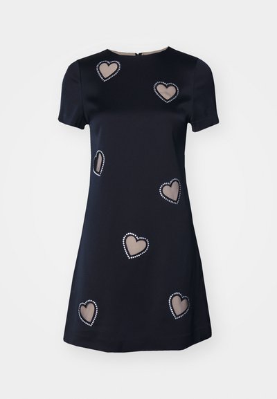 Navy short-sleeve dress featuring decorative heart cutouts outlined with white beading, smooth fabric, and a round neckline.