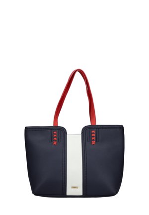 Navy and white tote bag with red handles, textured faux leather, and vertical red accents on sides. Features a gold logo on the front.