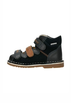 Black and brown toddler high-top shoe with three Velcro straps and beige rubber sole, stitched detailing along edges.