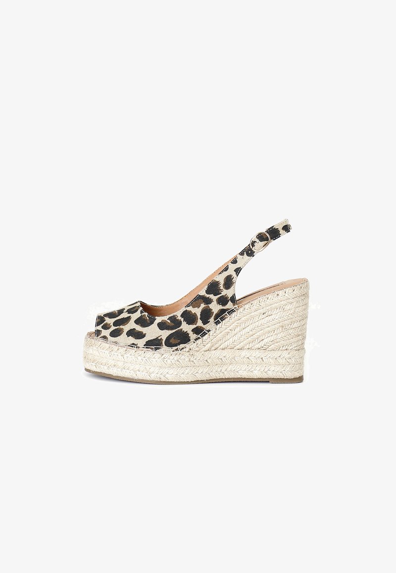 Leopard print espadrille wedge shoe with an open toe, tan inner lining, and a braided jute platform. Adjustable slingback strap for fit.