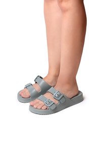 Gray slide sandals made of textured material, featuring dual adjustable buckles and a flat sole, exposing the toes.