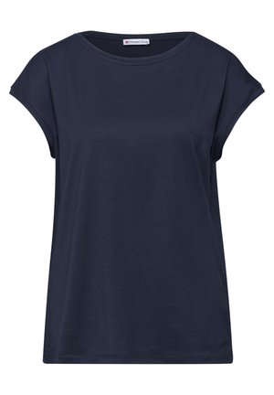 T-shirt femme bleu marine à manches courtes, col rond, manches légèrement roulées et petite étiquette de marque au niveau de l'encolure.