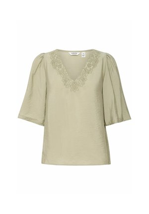 Blouse vert olive clair à manches courtes bouffantes, décolleté en V, et broderie florale au niveau de l'encolure. Tissu lisse et texturé.