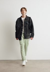 HUGO NOMPIO - Donji dijelovi trenirke - light/pastel green