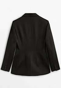 Blazer noir sur mesure pour femme avec manches longues, détails de coutures et poignets boutonnés, vu de dos sur fond blanc.