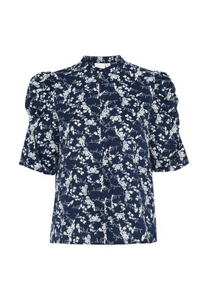 Laivansininen paita, jossa on valkoinen kukkakuosi, lyhyet puffihihat, nappisuljenta ja pystykaulus. Valmistettu kevyestä kankaasta.