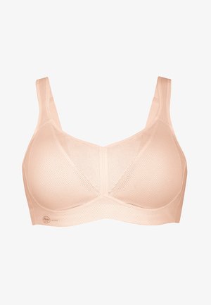 Perzikkleurige sportbeha van gaasstof, met brede banden, zachte cups en een naadloos ontwerp, met een subtiel merkje vlakbij de onderkant.