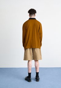 Carhartt WIP FLOYD SHORT - Shorts vaqueros - sand