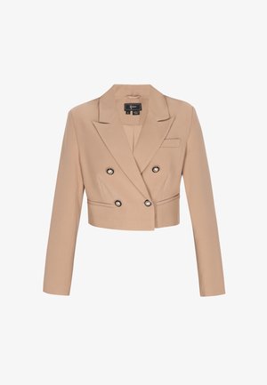 Przycięta beżowa marynarka dwurzędowa z guzikami perłowymi obszytymi czarną lamówką, z klapami z wycięciem, długimi rękawami i kieszeniami z przodu w formie wsuwek.