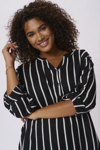 Black and white vertically striped blouse with a button-up front, roll-up sleeves, and a soft fabric texture. Features a collar and relaxed fit.
