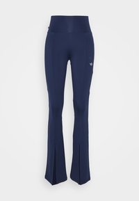 Navyblå utsvängda leggings med hög midja, tillverkade av stretchig tyg, med sidsprund och en liten logotyp på höften.