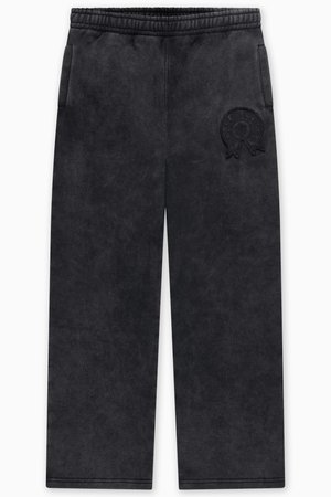 Černé teplákové kalhoty z měkké, texturované látky. Mají elastický pas, dvě boční kapsy a vyražené logo.