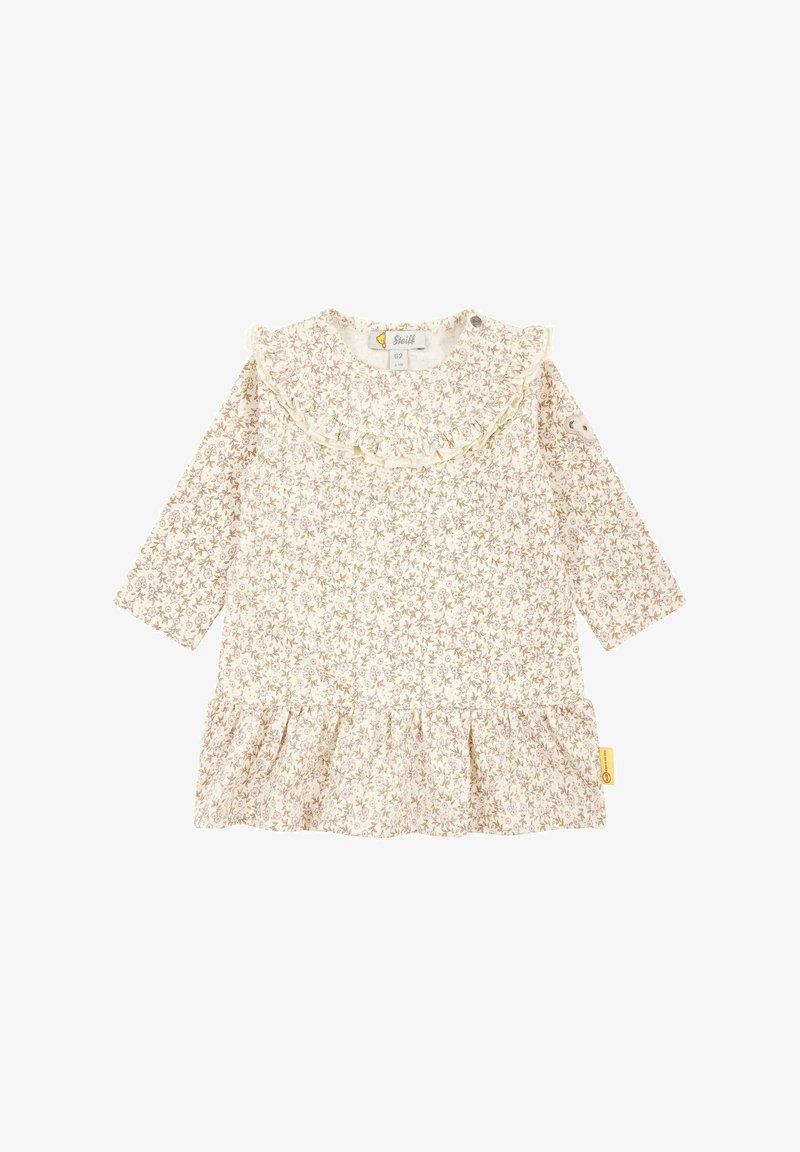 Langärmliges Kleid in Creme mit zarten Blumenmustern, Rüschensaum und gerafftem Saum. Aus weichem Stoff gefertigt, mit seitlichem Knopfverschluss.