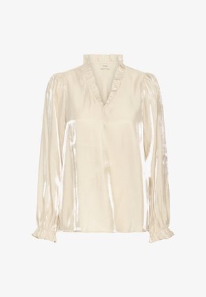 Blouse en ivoire brillant et doux avec un col en V et un col volanté ; possède de longues manches froncées avec des poignets élastiques. Texture lisse, design élégant.