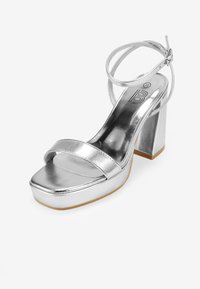 Bosanova CON CAMPANA - Sandalias de tacón - plata