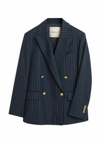 Blazer doppiopetto a righe navy con bottoni dorati, rever a lancia e due tasche frontali. Il tessuto appare liscio con una vestibilità sartoriale.