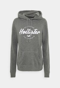 Gray hoodie made of cotton blend, featuring a front pocket, drawstrings, and a white circular logo with "Hollister Southern California."