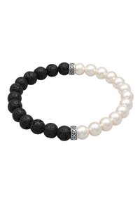 Svart lavasten och vit pärlbeadsarmband med silverdekorationer, som har växlade strukturerade svarta och släta vita sfäriska pärlor.