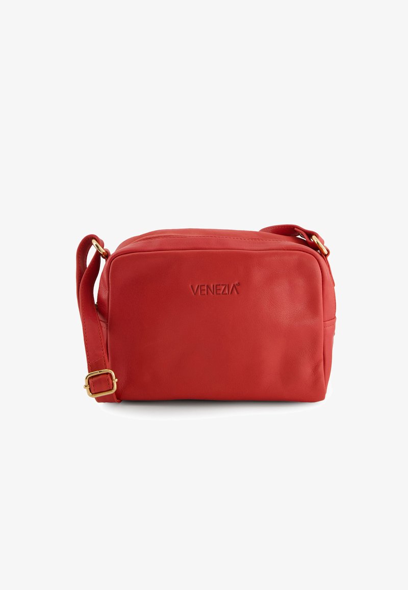 Red leather crossbody bag with a zip closure, adjustable strap, and embossed brand logo on the front, featuring a smooth texture.