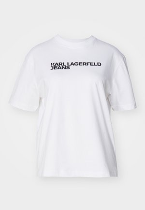 Vit bomulls-t-shirt med avslappnad passform. Har texten "KARL LAGERFELD JEANS" tryckt i fet svart text över bröstet. Kortärmad.