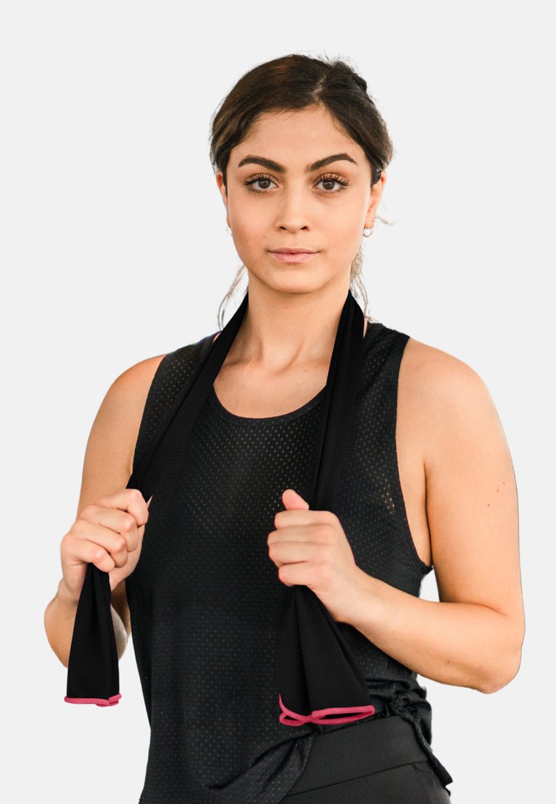 Black mesh workout top with thin straps, featuring a knot detail at the side. The model holds a black resistance band with pink accents.