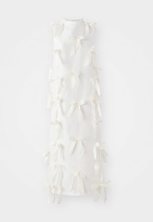 White sleeveless dress featuring numerous tied bows along the front, crafted from a lightweight fabric with a plain texture.