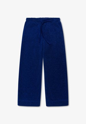 Blauwe, wijde sweatpants gemaakt van zachte, gestructureerde stof. Heeft een verstelbare tailleband met trekkoord. Geen zakken.