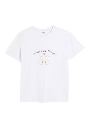 Hvid bomulds t-shirt med korte ærmer og rund halsudskæring, prydet med et trykt design af to kaniner og teksten "Små søde ting."