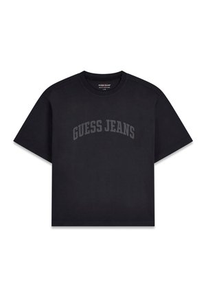 T-shirt nera a maniche corte con scollo rotondo, con la scritta "GUESS JEANS" stampata in testo arcuato di colore grigio scuro sul petto.