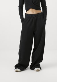 Champion EMOTIONAL DANCE WIDE LEG PANTS - Treniņtērpa apakšdaļas - black