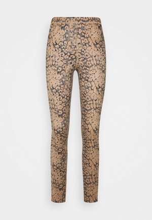 Legíny s zvířecím potiskem v béžovo-černé barevné kombinaci, s přiléhavým střihem a hladkou texturou. Doplňuje je leopardí vzor.