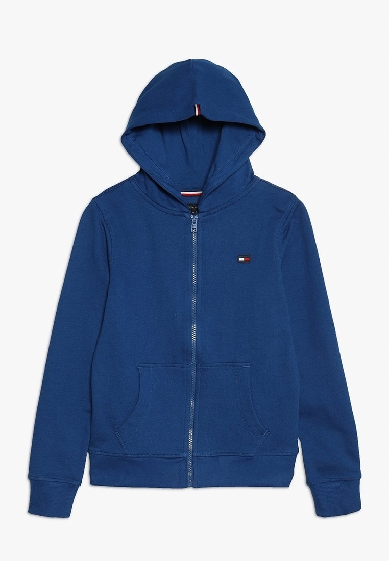Felpa blu con zip, tasca frontale, cappuccio con coulisse e piccolo logo ricamato sul petto. Realizzata in un morbido tessuto testurizzato.