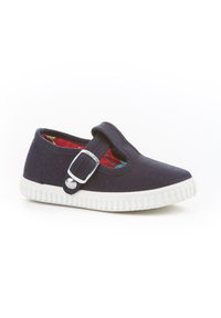 Zapato de lona azul marino con suela de goma blanca, que presenta un broche en el lateral y un forro interior con patrón rojo. Diseñado para facilitar su uso.