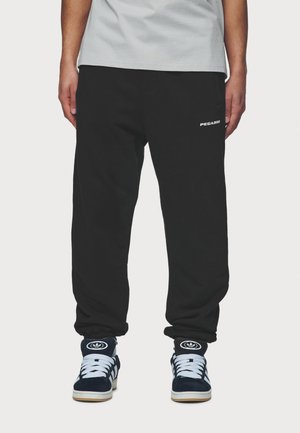 LOGO JOGGER - Tracksuit bottoms - washed black/white gum