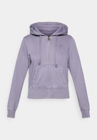 Purple zip-up hoodie with a drawstring hood, front pockets, and ribbed cuffs. Features a stitched logo on the chest. Soft material with a casual fit.