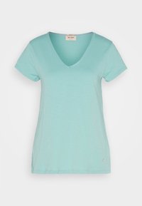 T-shirt à col en V de couleur bleu sarcelle claire avec manches courtes, fabriqué en tissu doux mélange de coton. Présente un petit logo près de l'ourlet.
