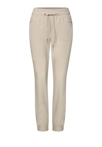 Ljusbeige joggers med elastisk midja och dragsko, med sidfickor och ett insvängt benen design.