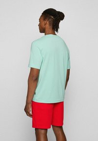 BOSS TCHUP - T-shirt básica - light green eight