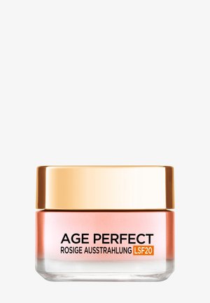 Pot rose et transparent avec un couvercle doré, étiqueté "AGE PERFECT ROSIGE AUSSTRAHLUNG LSF20", conçu pour une utilisation en soin de la peau.