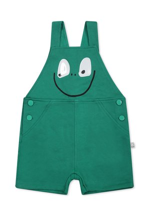 Salopette verde in cotone con grafica di faccia di rana, grandi occhi bianchi e bocca sorridente. Inclusi due bottoni laterali e tasche.