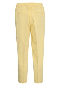 Yellow, relaxed-fit pants made of soft fabric. Features an elastic waistband and two back pockets. Smooth texture with tapered legs.