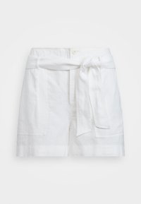 White high-waist linen shorts with large front pockets and a fabric belt tied in a knot at the waist.