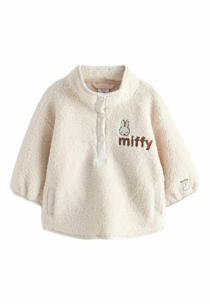 Kreemivärvi fliispullover kõrge kaelusega, millel on ees nööbid ja tikand "miffy" kujundusega rinnal. Pehme tekstuur.