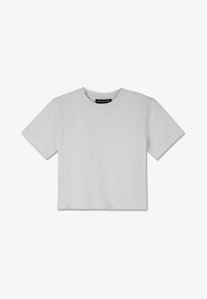 Biała, krótka koszulka z bawełny, z okrągłym dekoltem i krótkimi rękawami. Dyskretny wytłaczany logo na piersi.