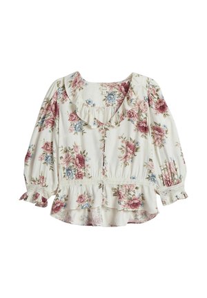 Blomstret bluse med korte, puffede ærmer, en rynket halsudskæring og en peplum kant. Cremefarvet baggrund med pink og blå blomstermønstre.