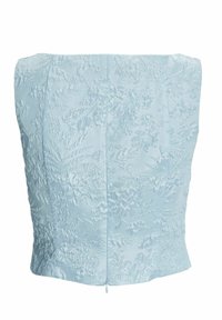 Haut bustier bleu clair en jacquard floral texturé avec fermeture éclair centrale au dos.