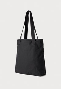 Sac fourre-tout en toile noire avec deux anses en tissu, forme rectangulaire, texture lisse, sans quincaillerie visible ni motifs.